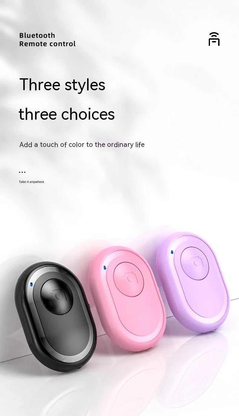 Bluetooth remote control for smartphones with self-timer, showing black, pink and purple colour options
