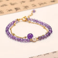 Amethyst crystal bracelet with diamond-shaped stones, adjustable chain, and Chinese-style clasp on wrist