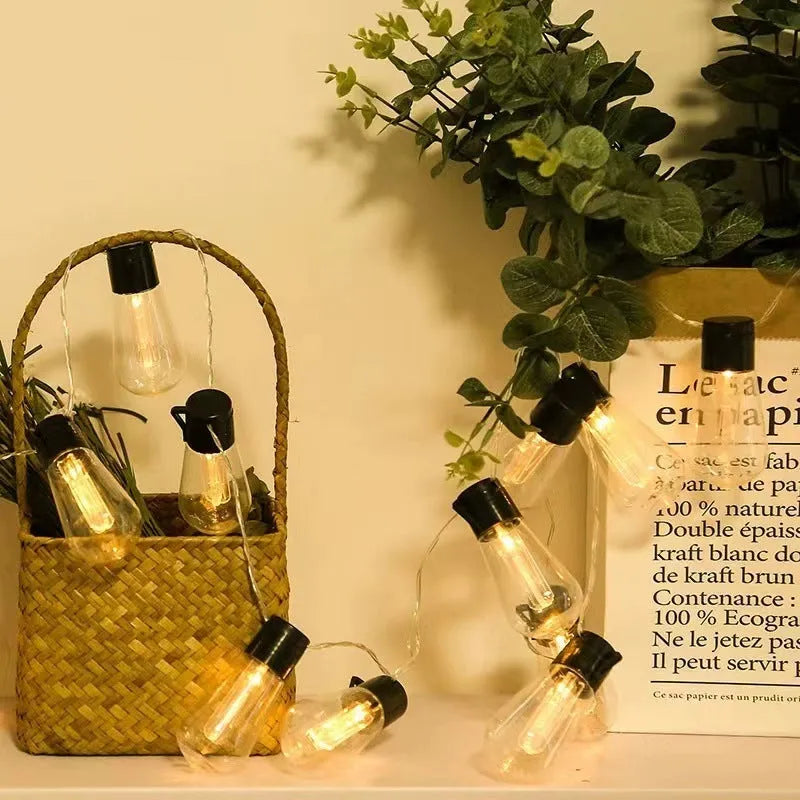 Retro infusion bottle shaped outdoor string lights with 40 bulbs on 10 metre cable, IP55 waterproof rating for garden use