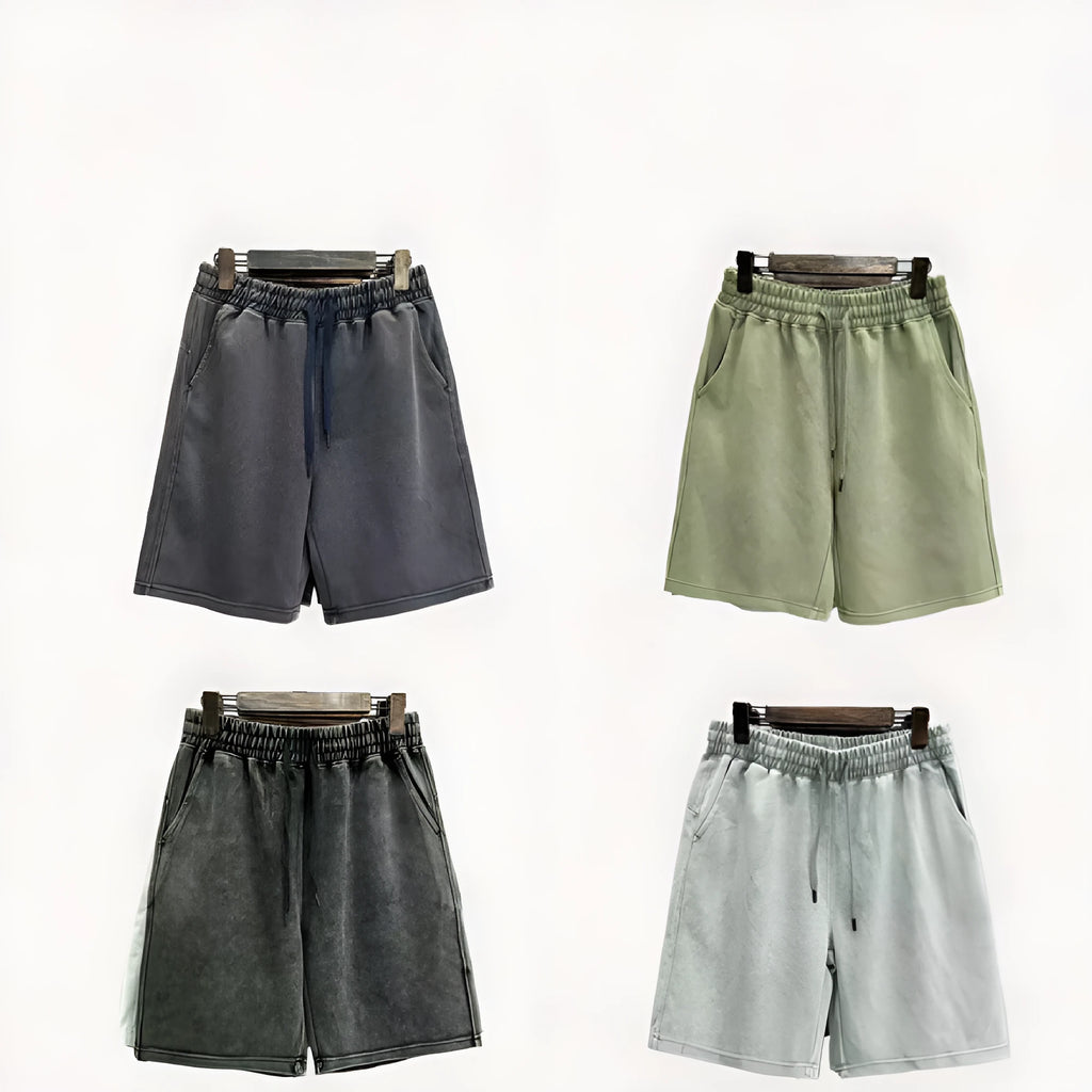 Man wearing navy blue distressed cotton casual shorts with a loose, straight-leg fit.