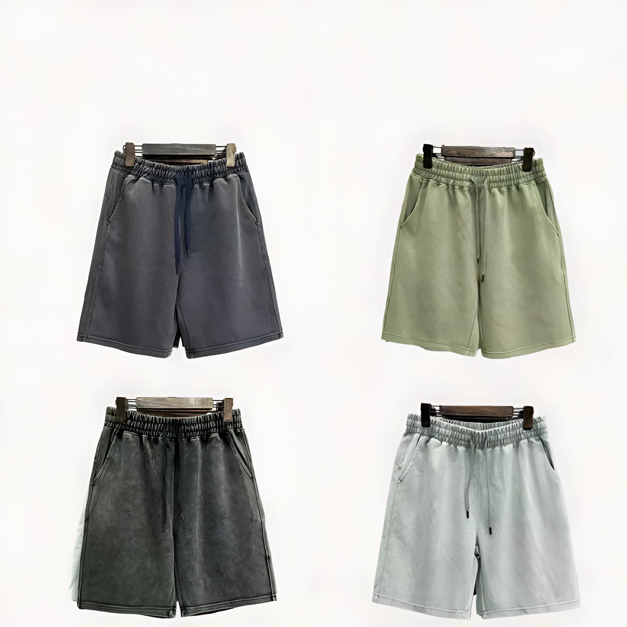 Man wearing navy blue distressed cotton casual shorts with a loose, straight-leg fit.