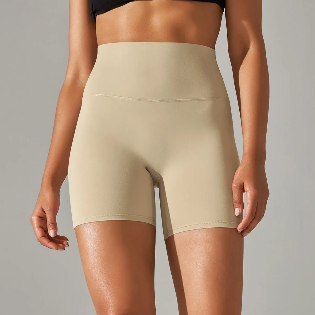 Women's high waist hip lift fitness tights in dark green, shown for sports and casual wear.