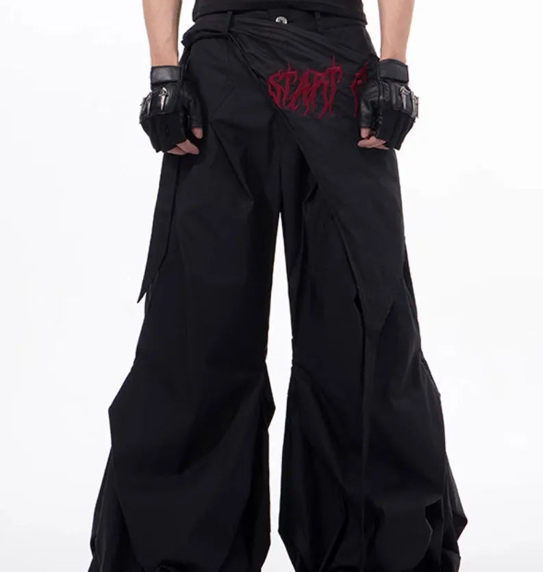 Boy modelling black wide-leg Korean-style summer trousers.