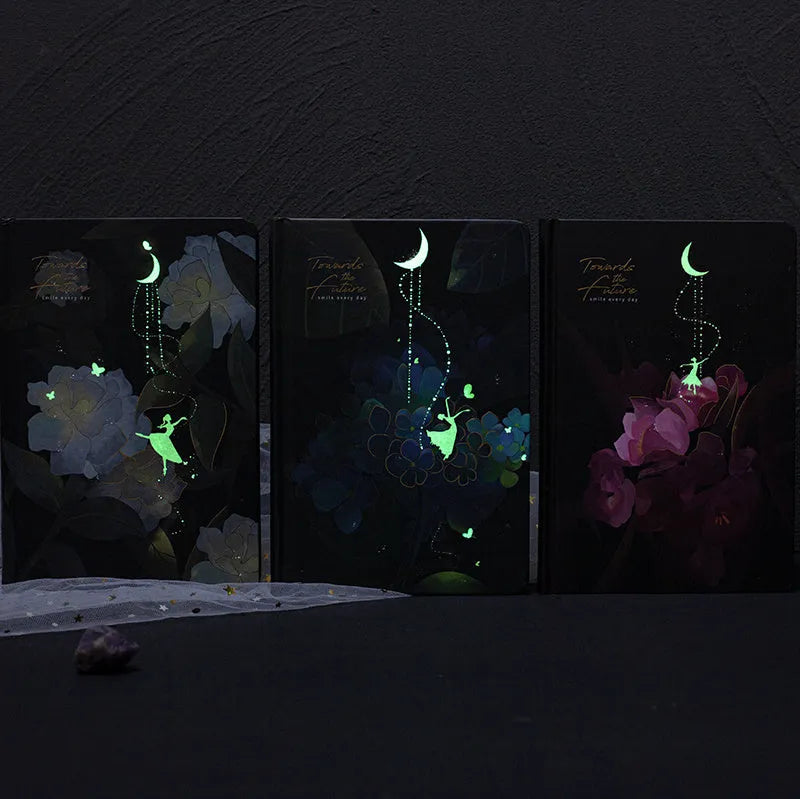 A5 notebook with luminous cover in Deep Blue, open to show colour illustration pages, size 21 x 14.8 cm