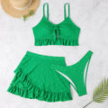 Women's solid colour split hip skirt bikini swimsuit three-piece set on a mannequin.