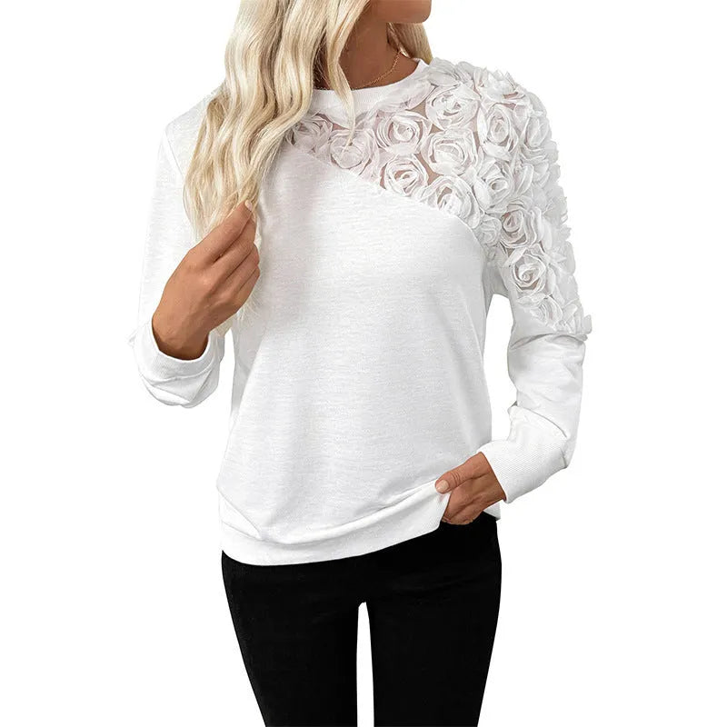 Long sleeve white top with floral pattern in loose pullover style, sizes S to XL
