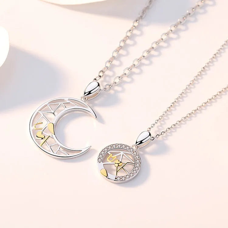 Sun Moon Tooth Couple Necklace with copper electroplated pendants showing sun and moon symbols on cross chain
