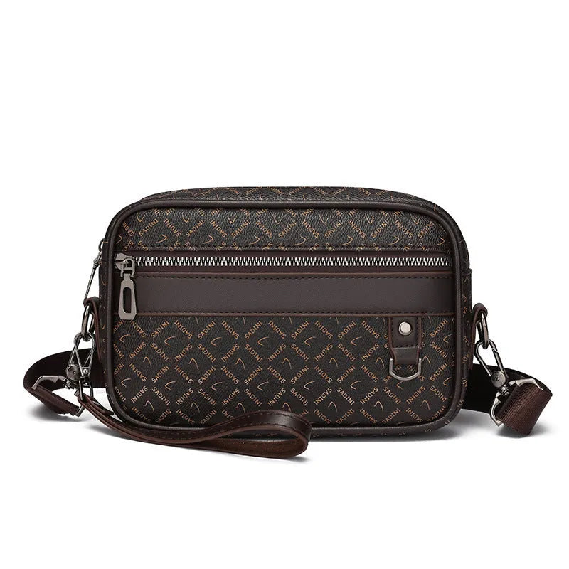 Men's black casual shoulder messenger bag with geometric pattern and handheld strap.