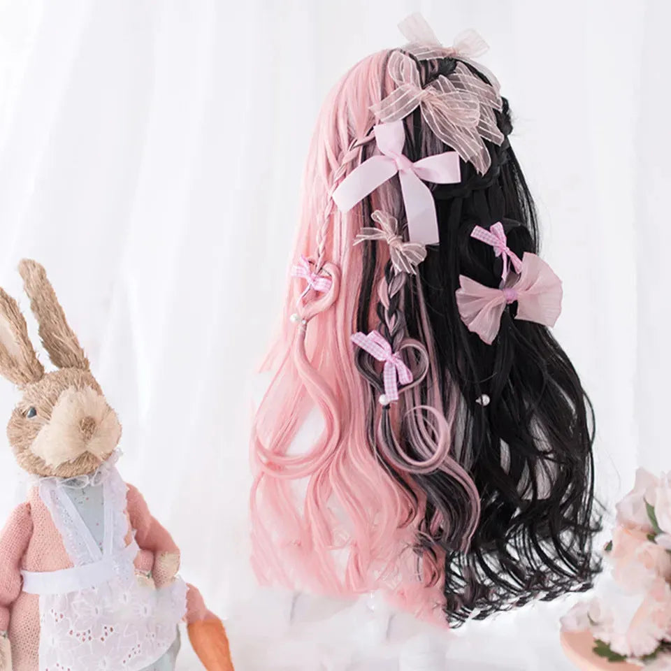 Harajuku Japanese Lolita long curly wig in black and pink colours with bangs on a wig stand.