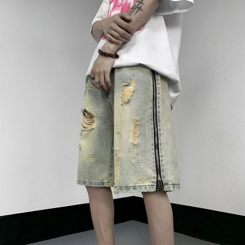Retro blue men's ripped denim shorts with a loose fit and straight leg opening on a cardigan.