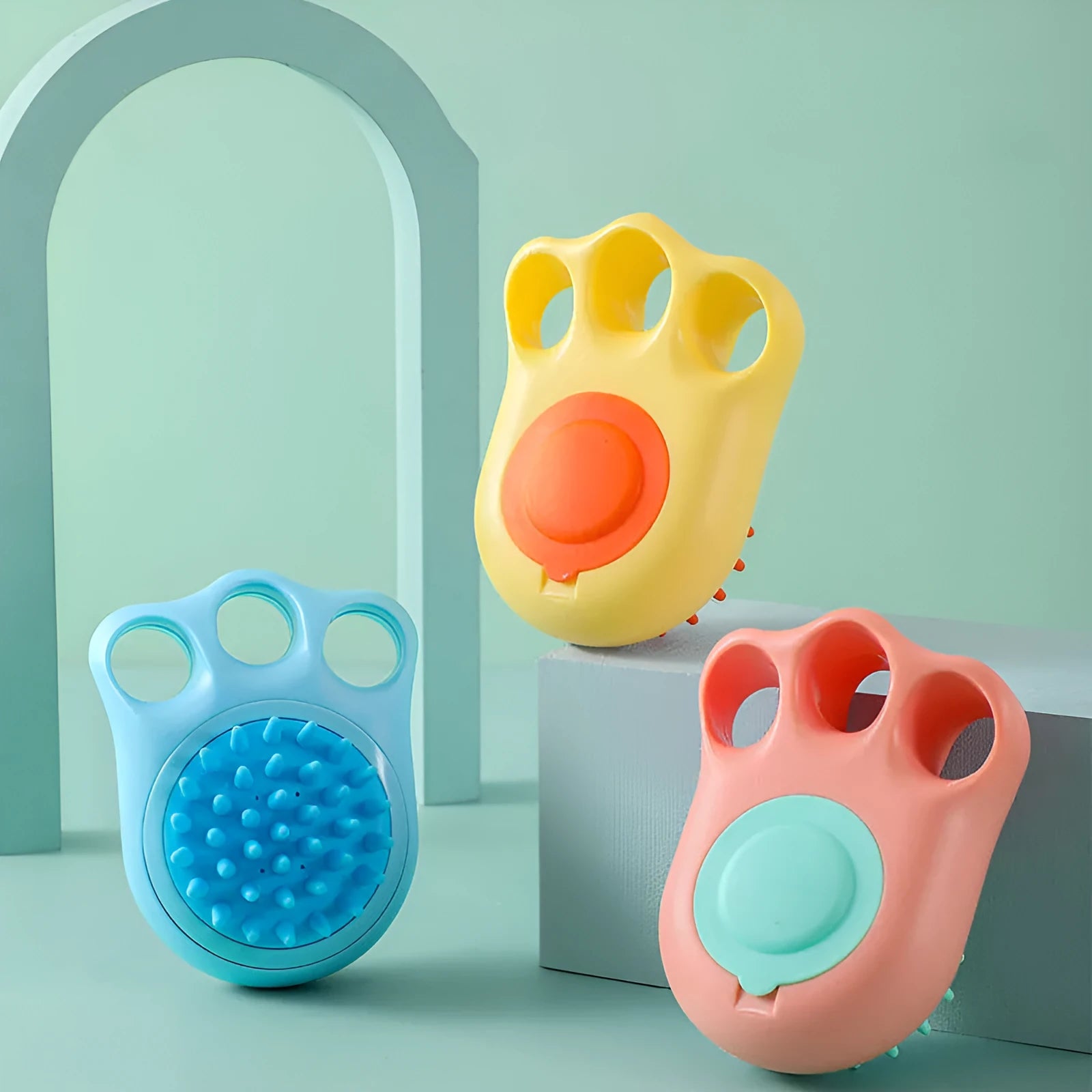 Blue pet bath and massage brush with soft silicone bristles and a plastic handle for cats and dogs.