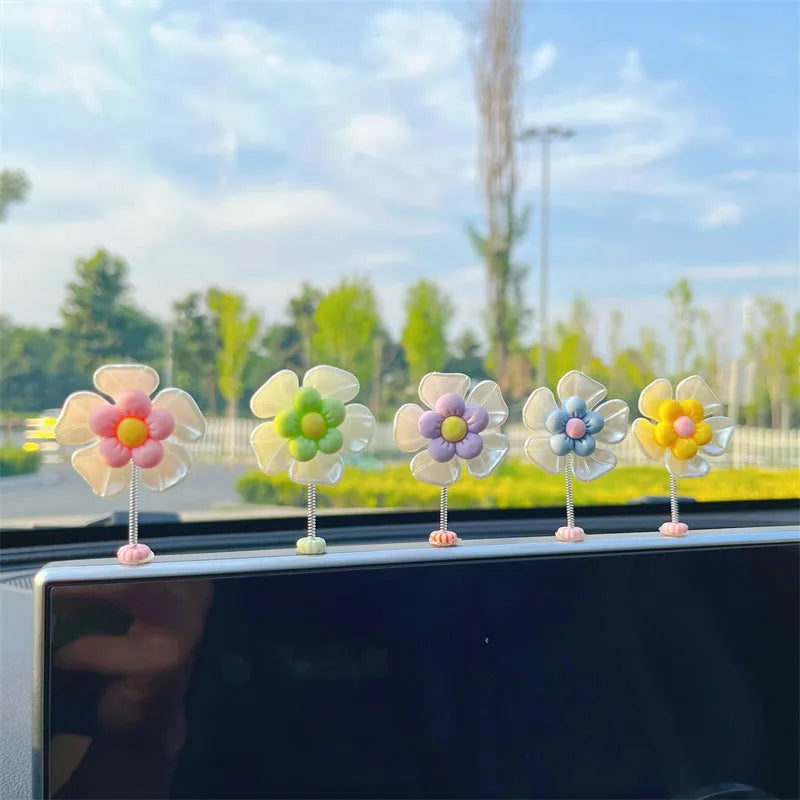 Plastic car swing decoration measuring 5cm tall in blue, green, pink, purple, and yellow colour options
