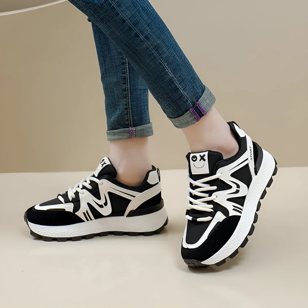Women's grey casual lace-up shoes with round toe and flat heel on a white background.