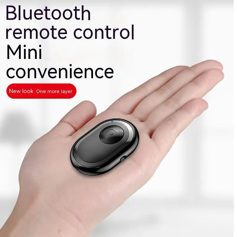 Bluetooth remote control for smartphones with self-timer, showing black, pink and purple colour options