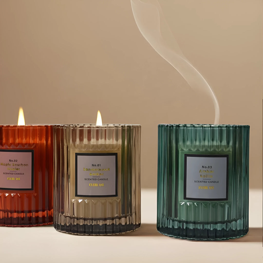Soy wax aromatherapy candle in cylindrical shape showing amber, green and red colour options