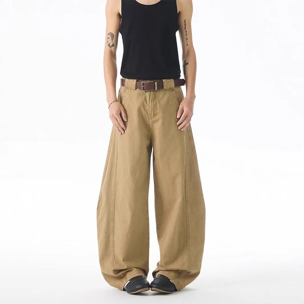 Men's brown straight-leg jeans with micro-elasticity, button-fly opening, and mid-waist design