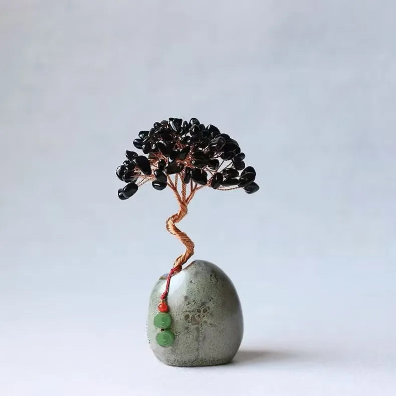 Natural citrine crystal Pachira Macrocarpa lucky ornament on a plain background.