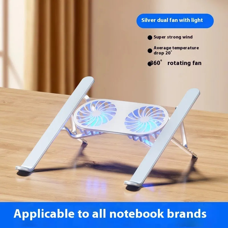 Silver aluminium laptop stand with twin cooling fans in folded position beside laptop