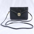 Retro soft-surface crossbody messenger bag with flap closure and lock detail in wine red colour