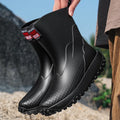Men's mid-height PVC rain boot in beige with round toe and plastic sole.