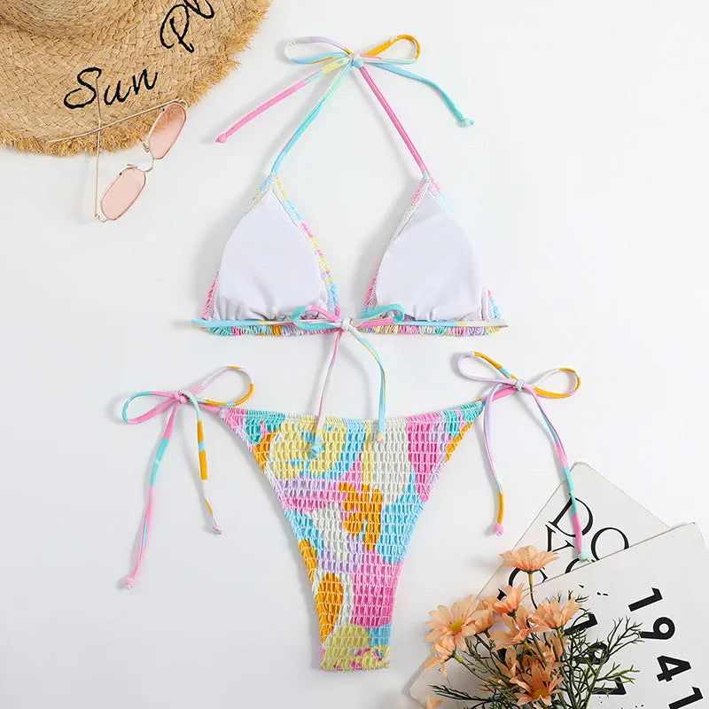 Women's multicolour floral triangle bikini with smocking detail on the top and briefs bottom.