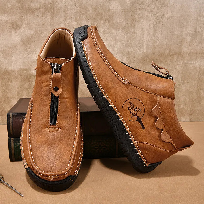Men's slip-on loafers in black with round toe, low heel, and sewing thread details on PU upper