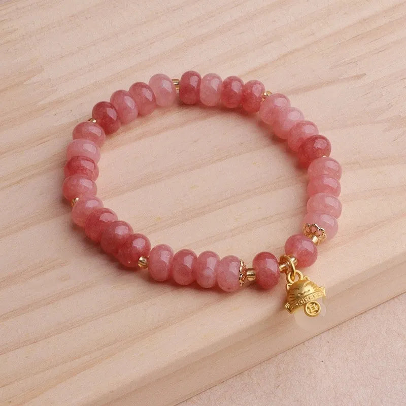Women's strawberry quartz lucky cat bracelet with animal zodiac charm and retro styling