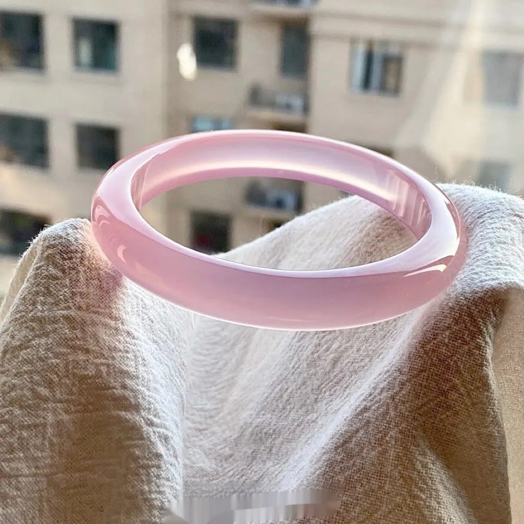 Natural agate bracelet with 10mm wide tyre beads showing pink agate colour variation and adjustable sizing