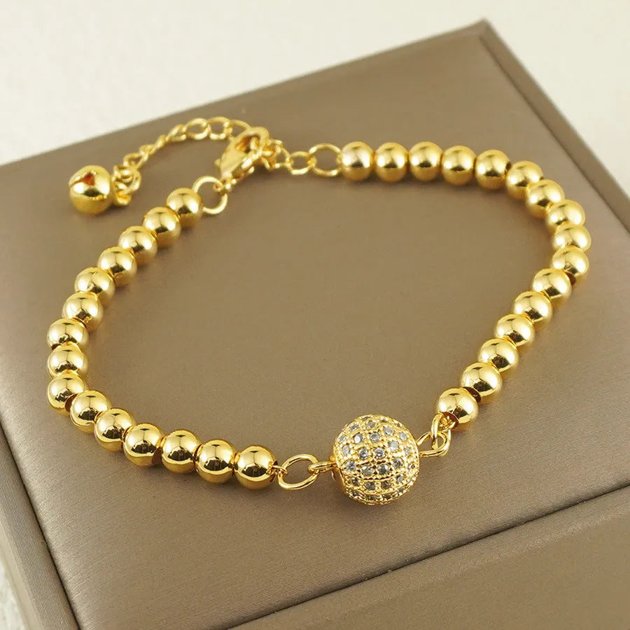 Women's copper bracelet with heart shape and round zircon stones in Arabic design style