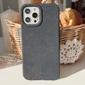 Biodegradable wheat straw fibre iPhone case showing rear protection and precise cutouts for cameras and ports