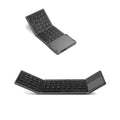Black mini tri-fold Bluetooth keyboard showing folded thickness of 0.8cm beside tablet