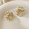 Women's copper flower basket earrings with small rice-shaped beads in gold finish, approximately 3-4 cm diameter