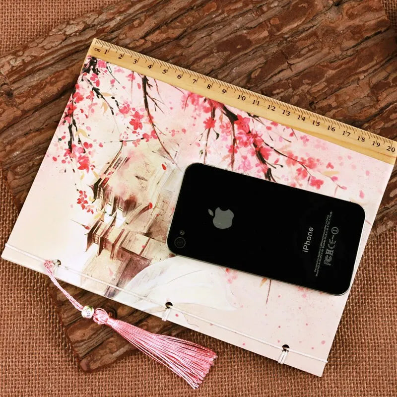 Chinese style thread-bound notebook with watercolour azalea design on cover, showing traditional binding