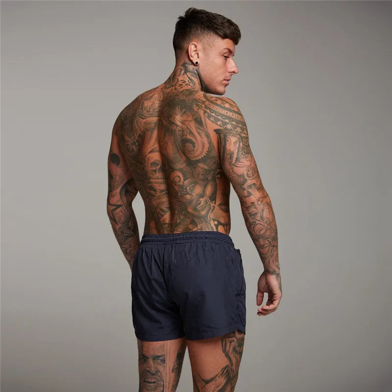 Men's nylon spandex swim shorts with elastic waist, available in green, black, navy, orange, sizes M-XXL