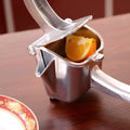 Silver heavy-duty aluminium and steel lemon squeezer with large bowl and lever.