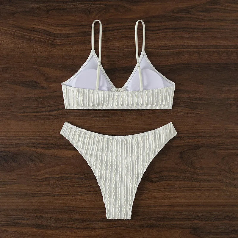 Women's white V-neck split swimsuit with sleeveless design, top and shorts set for beach swimming