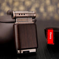 Ebony gas lighter with black wood body and rosewood decorative accents including sun surface and good luck designs