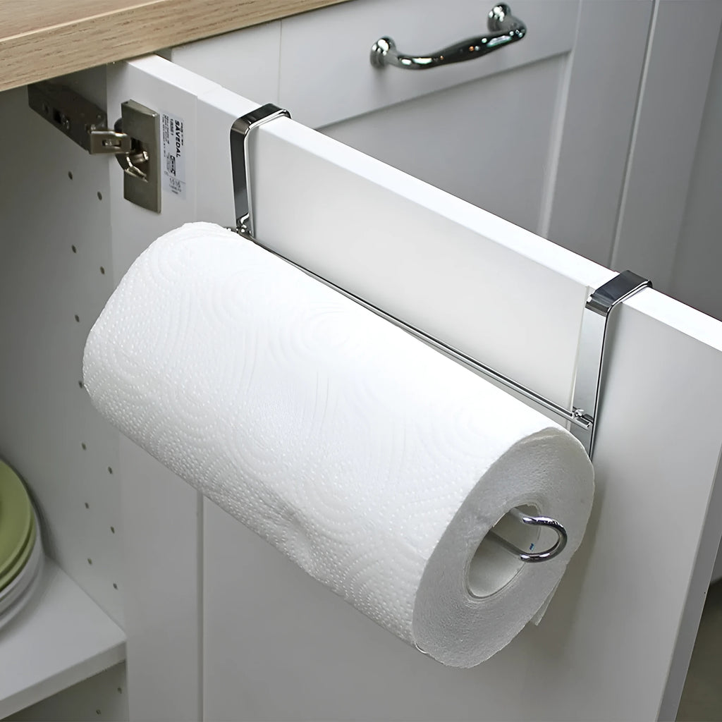 Silver stainless steel cabinet door back hanging paper towel rack on a kitchen cabinet.