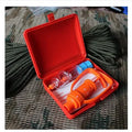 Orange venom suction device with two cup sizes, storage box, and accessories for outdoor first aid