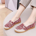 Women's ethnic style cloth shoes with flat heel, colour stitching, and a shallow mouth design.