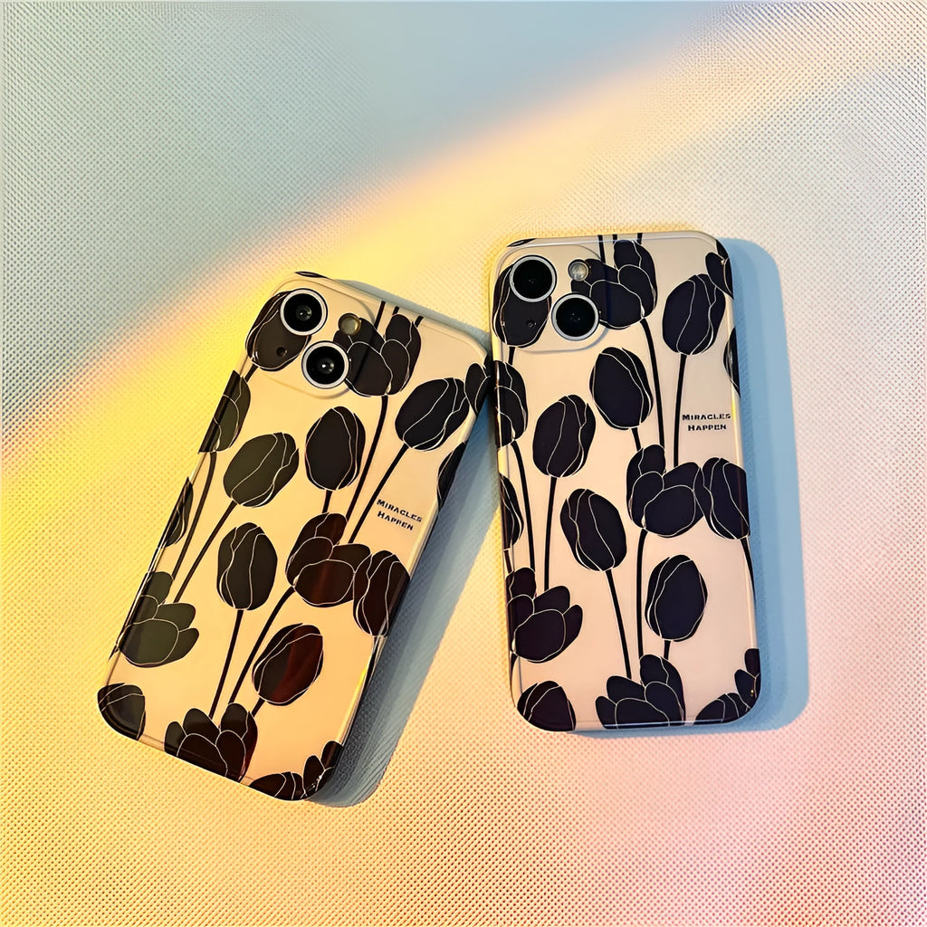Black silicone iPhone case with a detailed tulip floral pattern on the back.