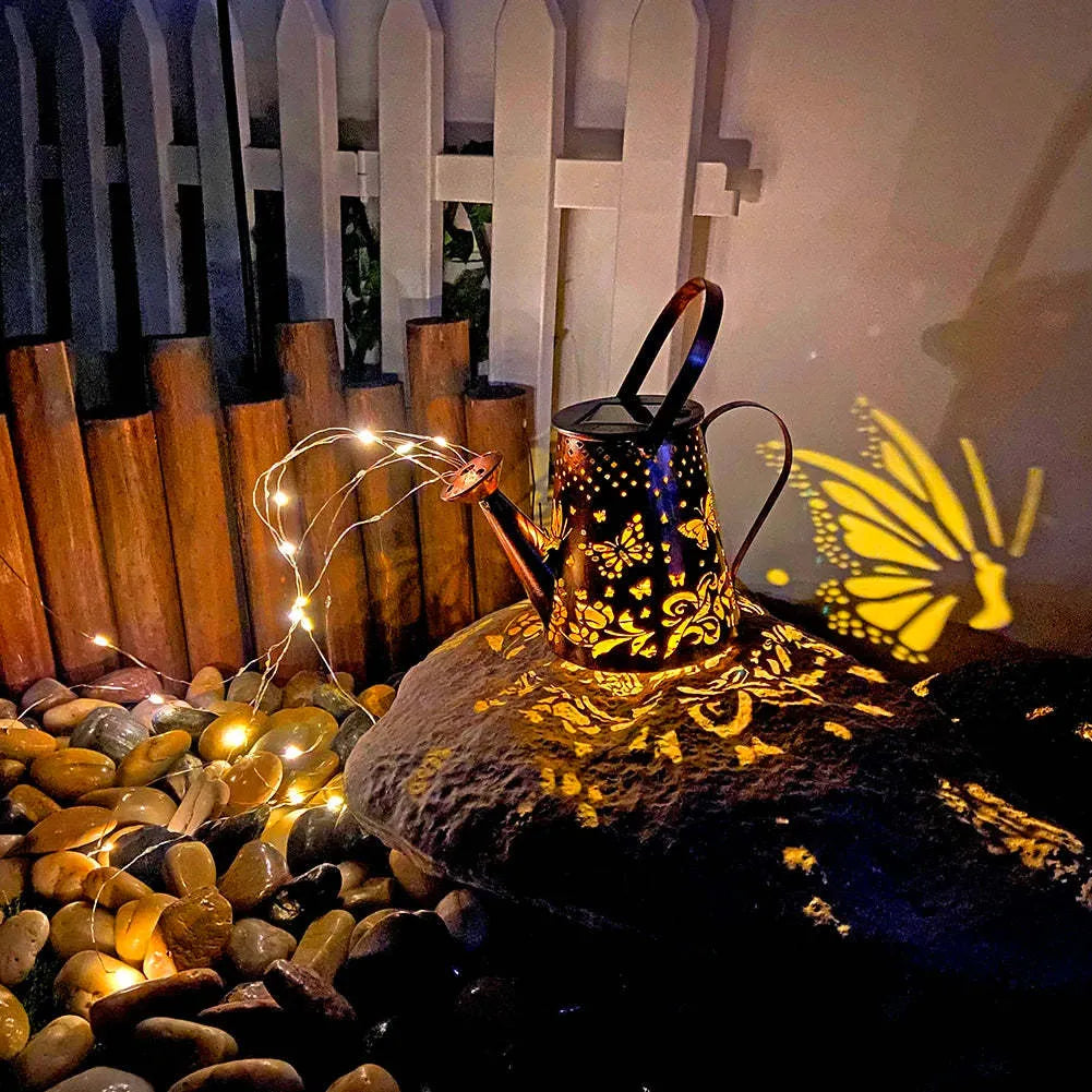 Solar-powered iron garden lamp with tapered butterfly design and warm white LED illumination