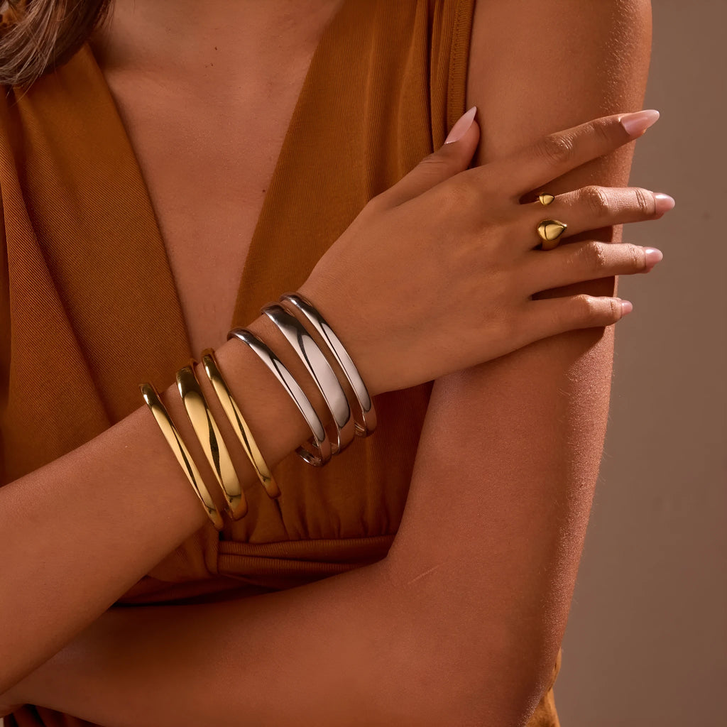 Stainless steel simple opening bracelet with geometric line design in gold or steel electroplated finish