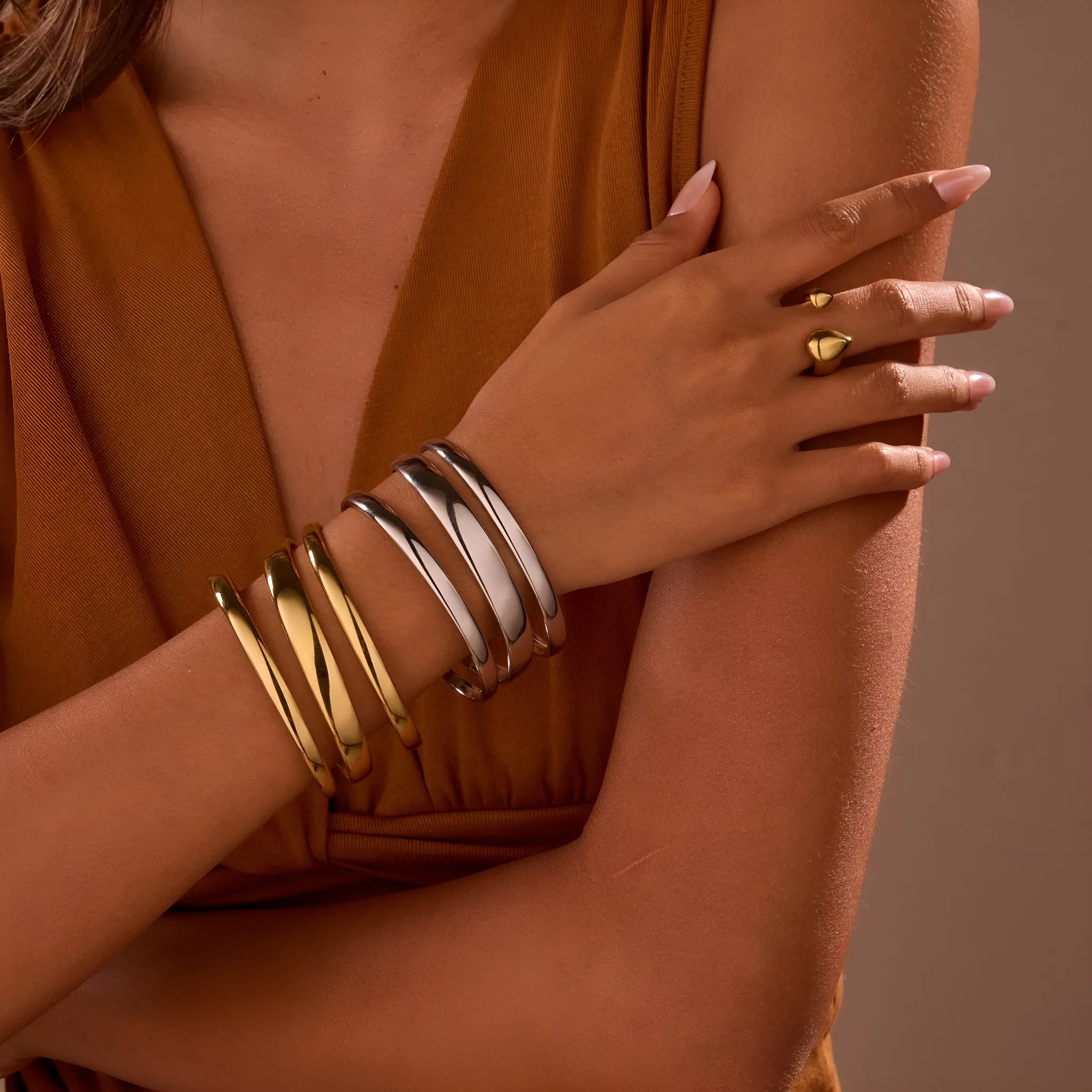 Stainless steel simple opening bracelet with geometric line design in gold or steel electroplated finish