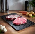 Black aluminium quick defrosting tray for thawing frozen food without electricity