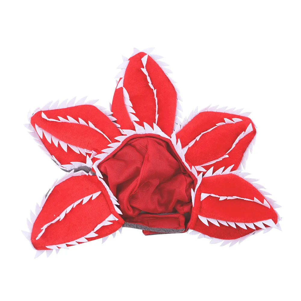 Dog wearing Halloween demon hat costume with headband and flower accessory