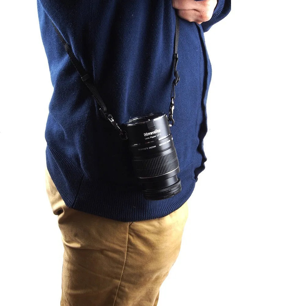 Aluminium alloy Nikon lens flipper holding two camera lenses with cotton shoulder strap