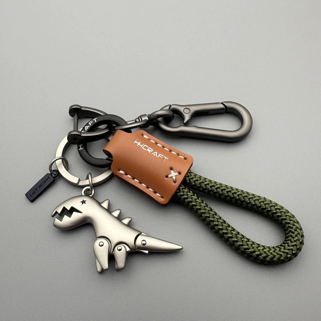 Cartoon little dinosaur keychain in zinc alloy, a schoolbag pendant in one of eight styles