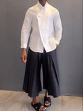 White asymmetric front long sleeve shirt with black pleated trousers casual matching set