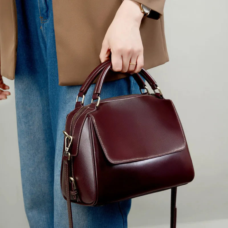 Women's soft genuine leather crossbody tote bag in apricot colour with slit pocket and double straps